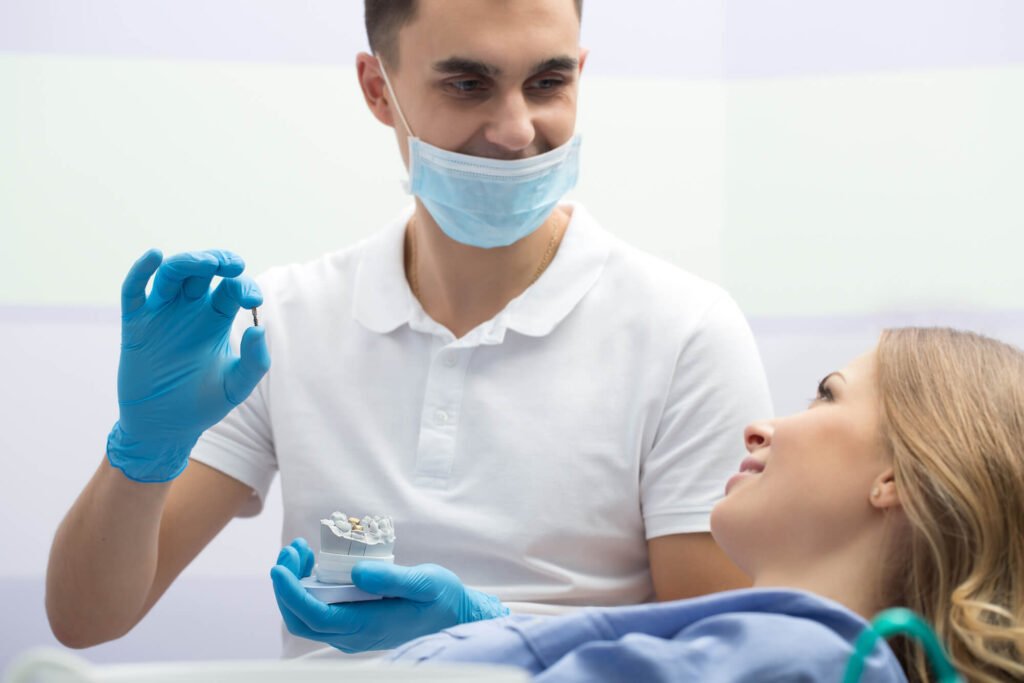 a dentist discussing Dental Implants in Cameron Park