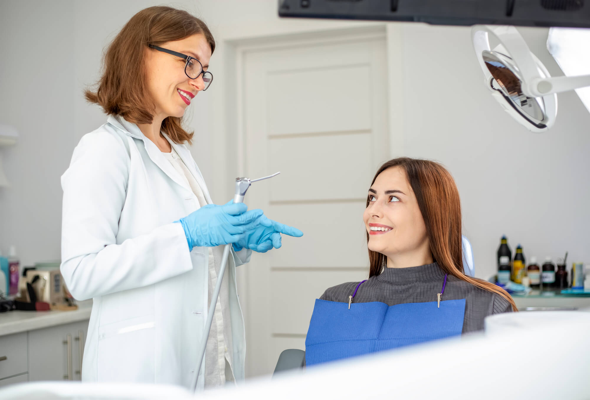 Dentist in placerville ca talking to a patient before a cleaning