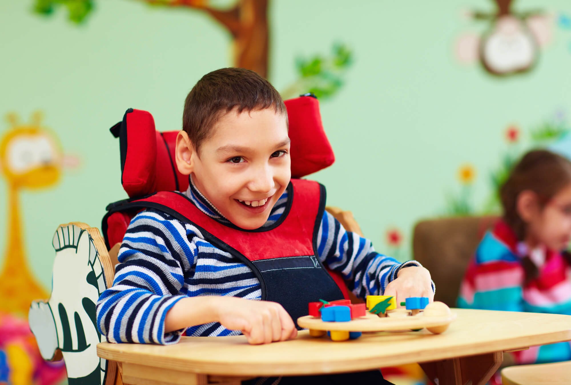 a child with cerebral palsy smiling after seeing a Cameron Park Dentist