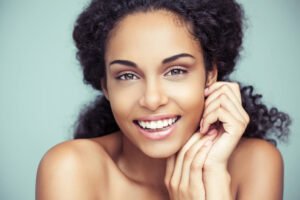 a woman smiling after receiving Cameron Park Cosmetic Dentistry